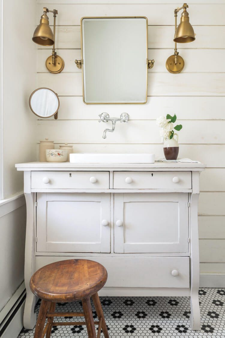 renovated bathroom in historic home with shiplap and hexagonal floor tile