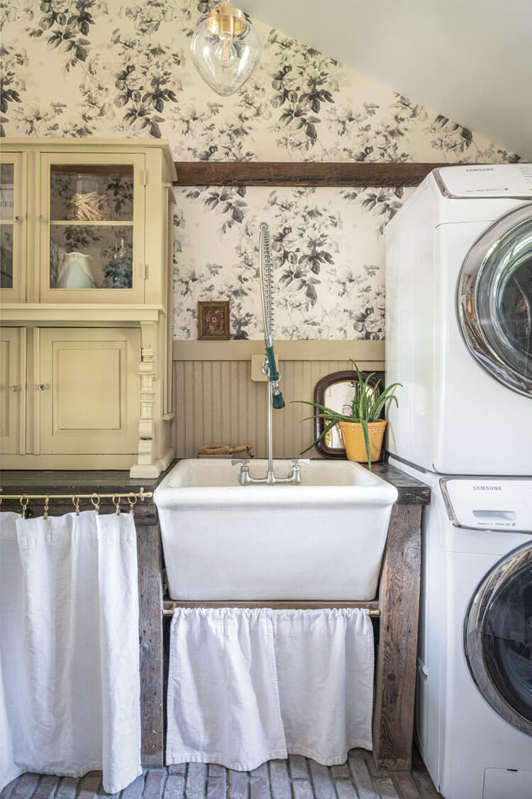 laundry room with floral wallpaper in historic farmhouse home