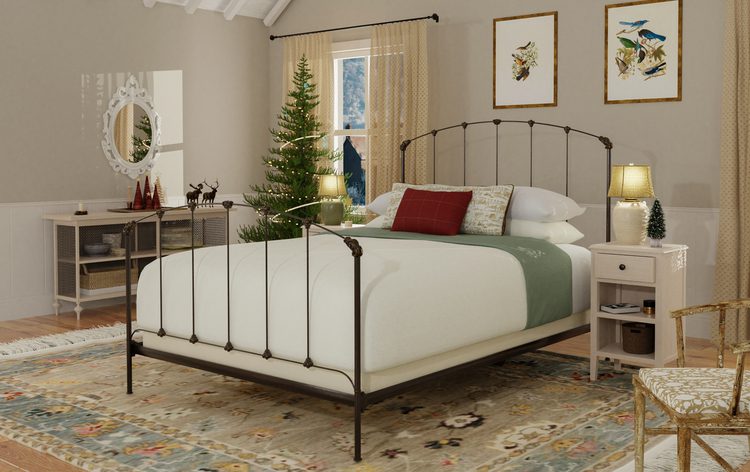 A bed that has an iron headboard and footboard