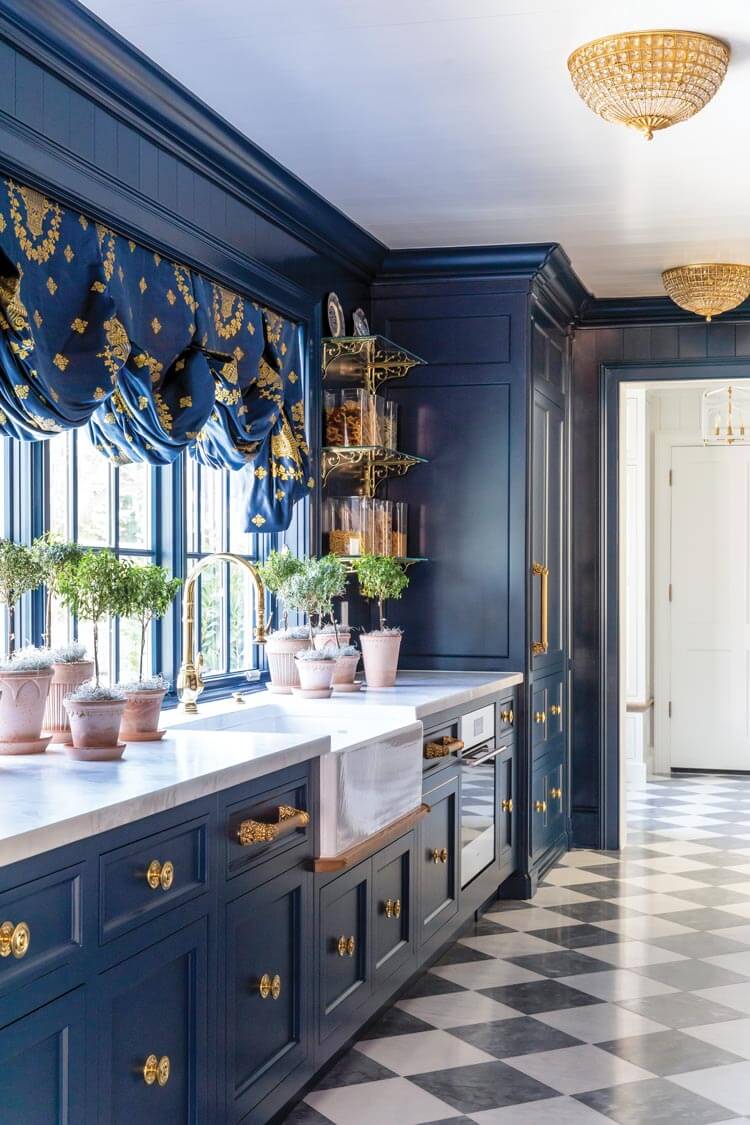 dark blue cabinetry kitchen with checkered floor