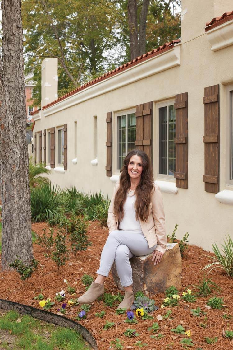 designer Sara McDaniels outside the restored Villas at Spanish Court