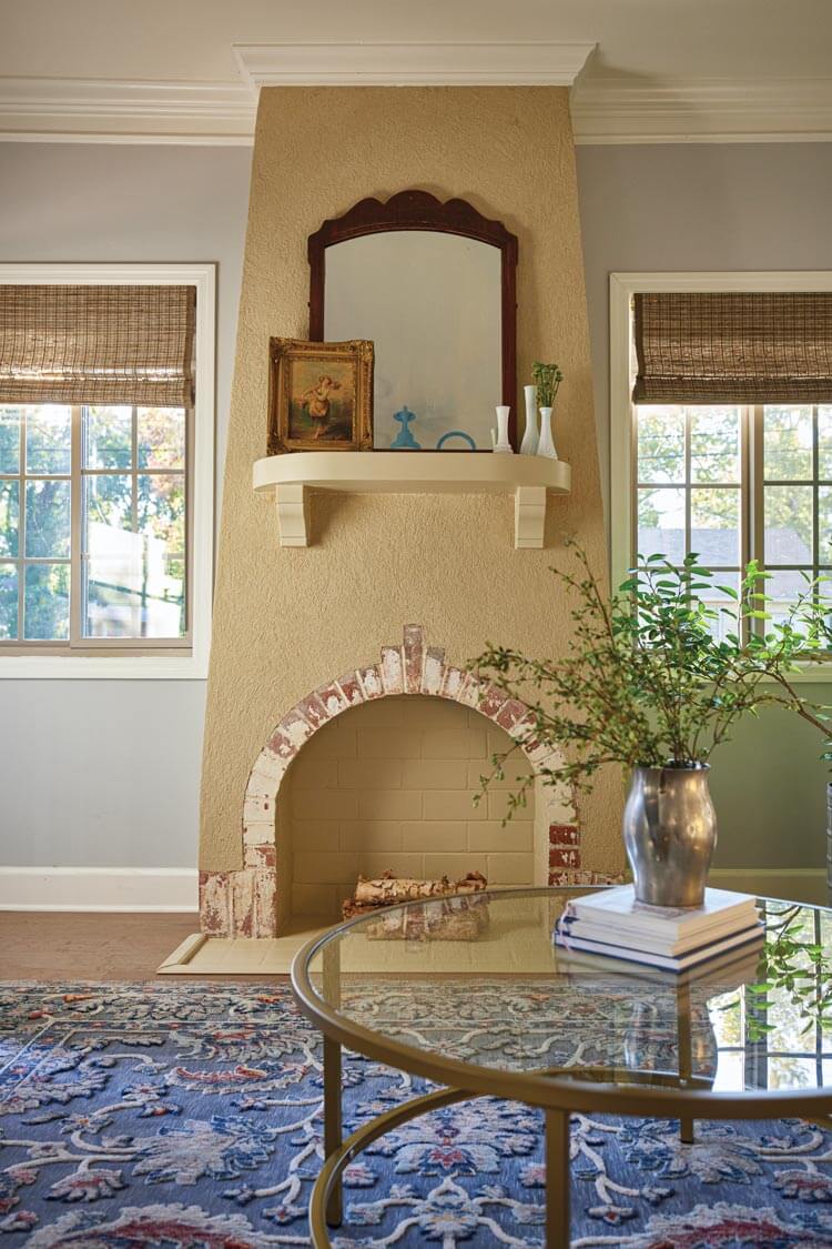 restored living room with fireplace at the Villas at Spanish Court