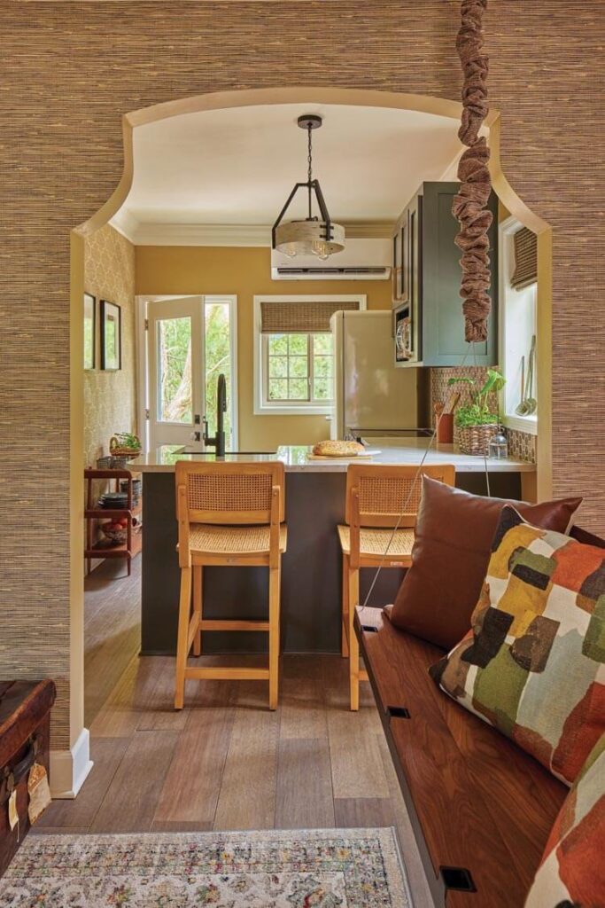 grasscloth wallpaper and warm muted color scheme in restored Villas at Spanish Court