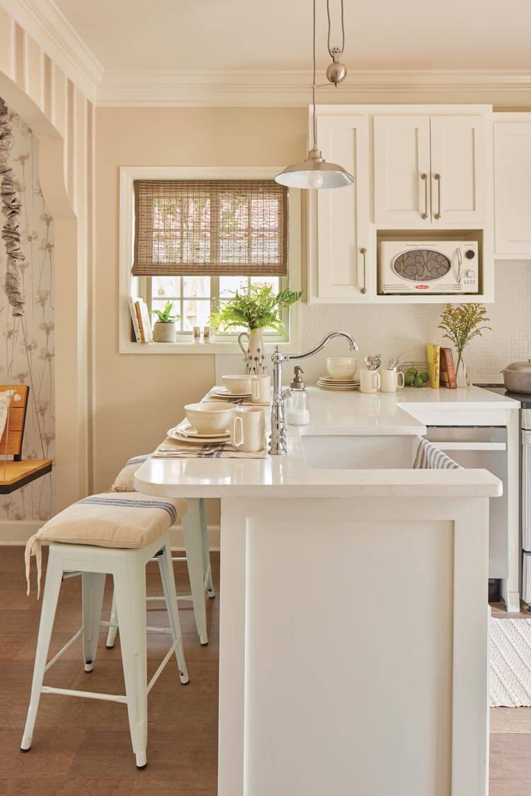 bar stool seating in neutral kitchen at Villas at Spanish Court