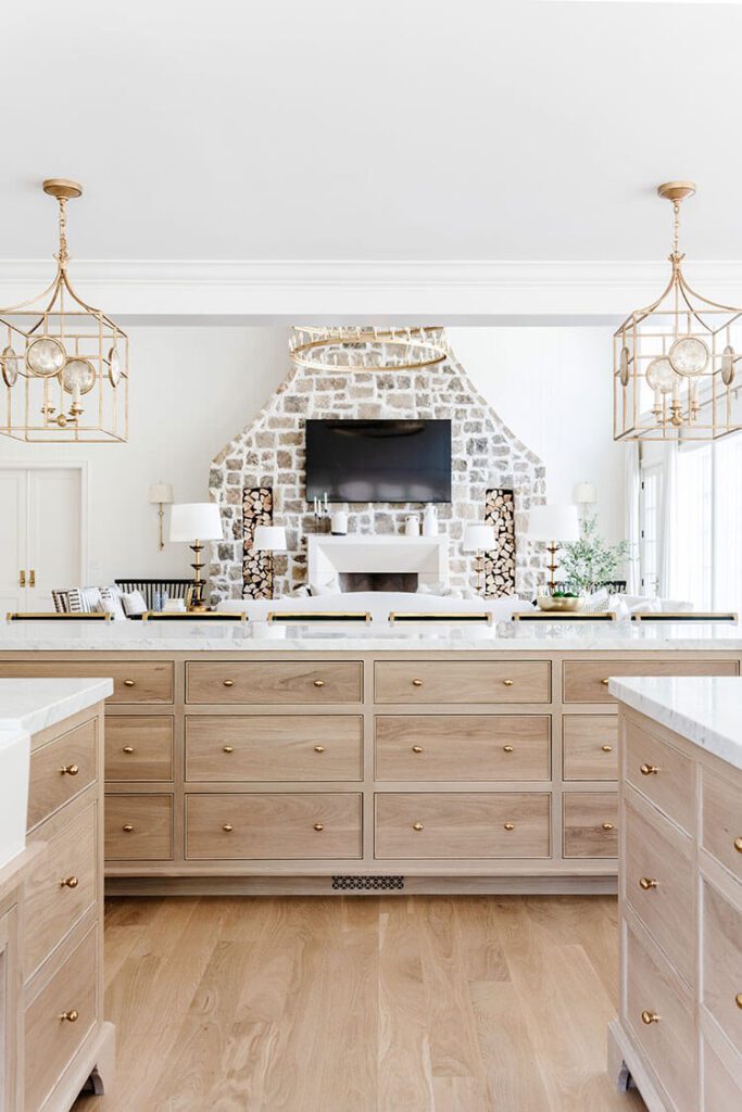 White kitchen with natural wood cabinets as one of the interior design trends of 2023