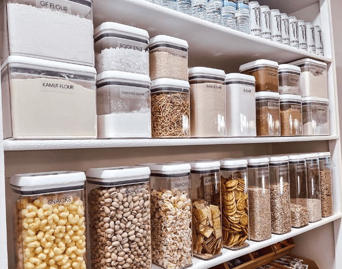 Open shelves with matching clear pantry organization containers and food