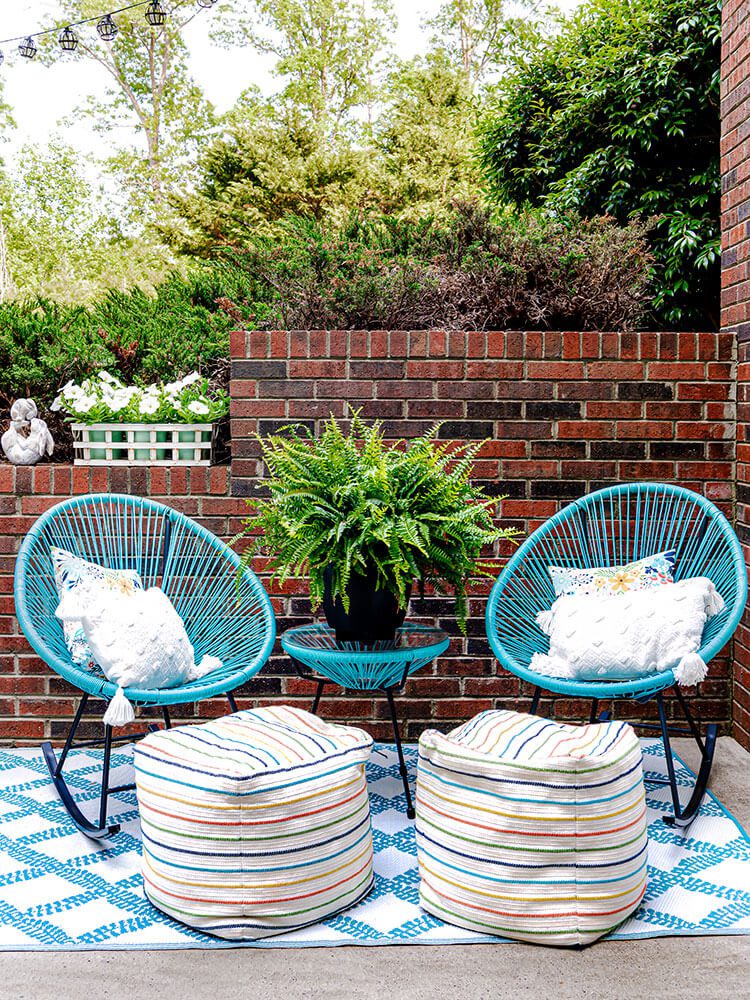 Two blue chairs and poufs for outdoor spring decorating