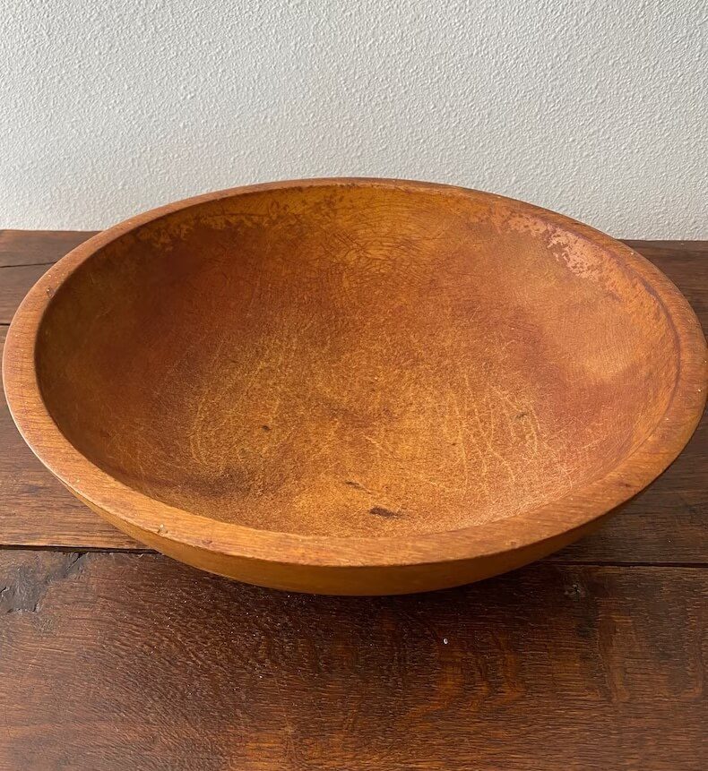 Vintage munising bowl on table with white wall behind