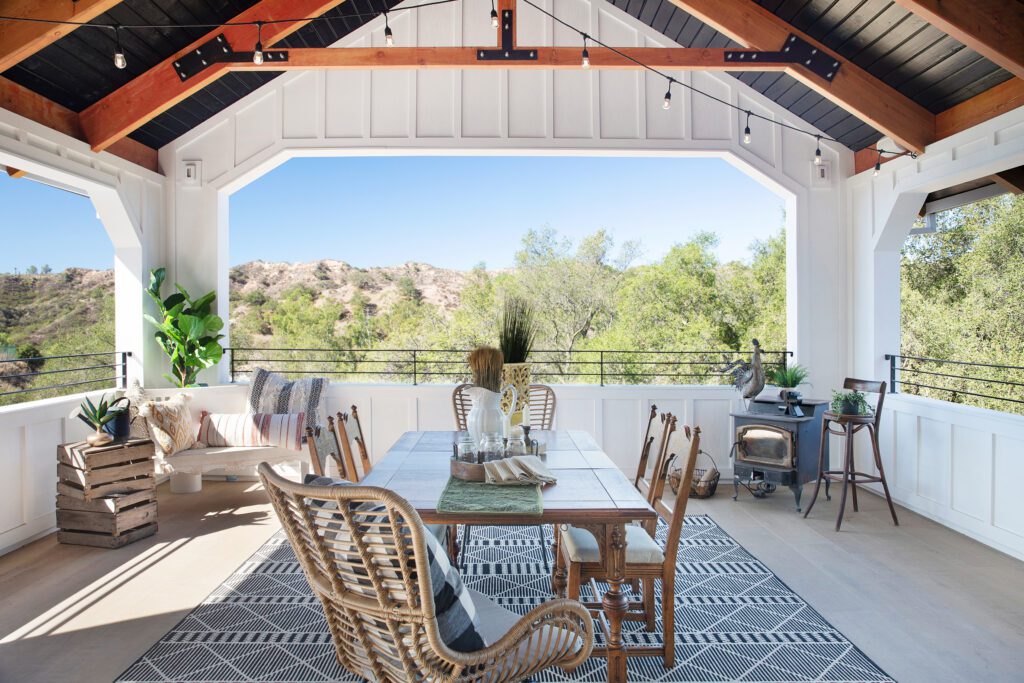 A covered deck has wraparound views of the Trabuco Canyon surroundings.