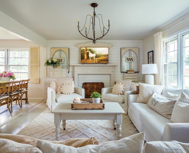 neutral living room with vintage windows and signs