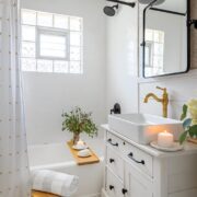 bathroom with refinished bathtub and repurposed dresser vanity