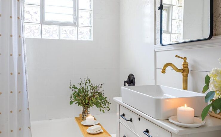 bathroom with refinished bathtub and repurposed dresser vanity