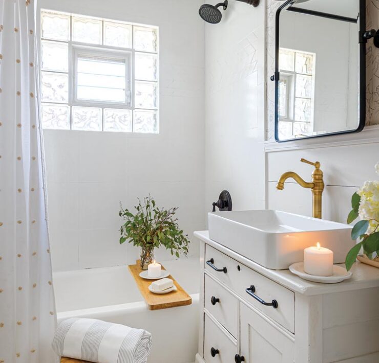 bathroom with refinished bathtub and repurposed dresser vanity