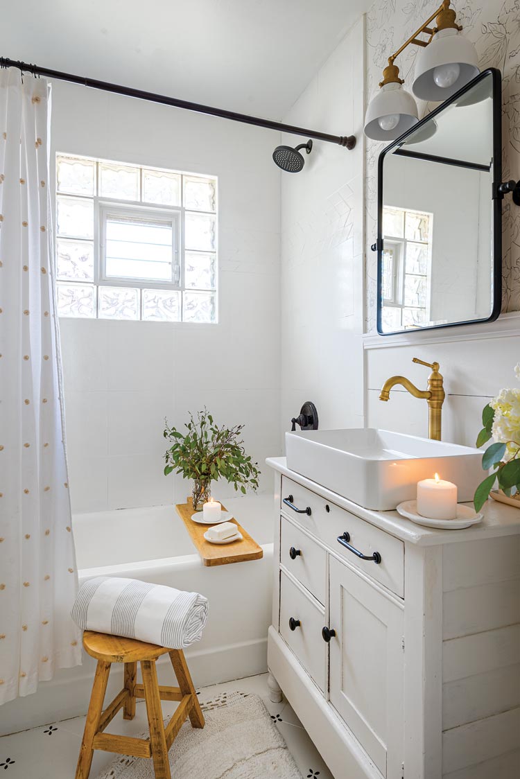 bathroom with refinished bathtub and repurposed dresser vanity