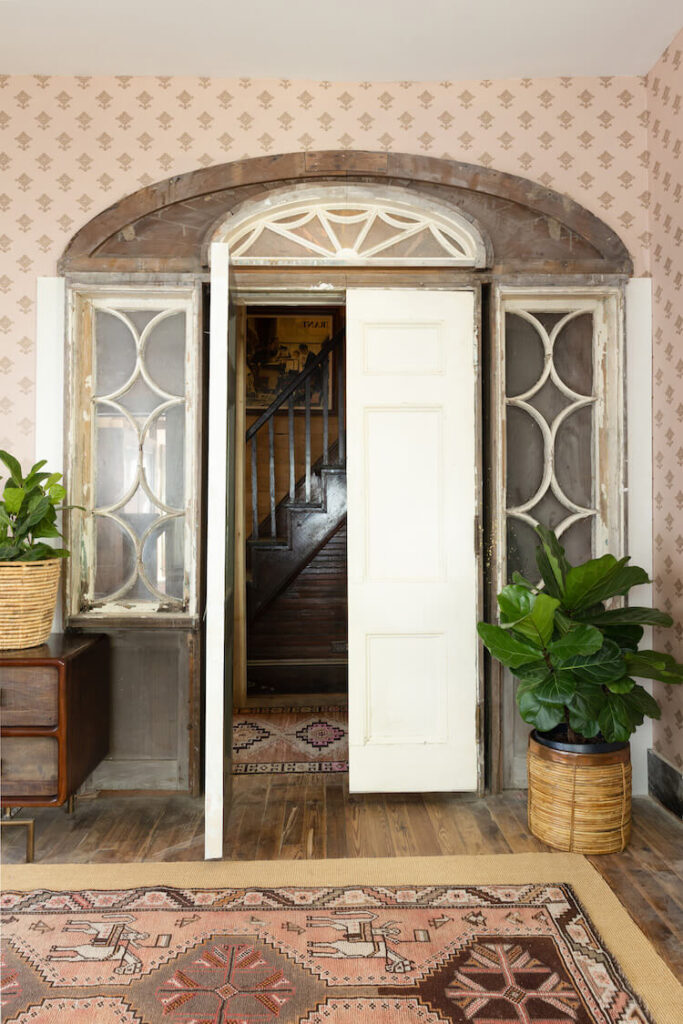 vintage windows repurposed to frame interior doorframe