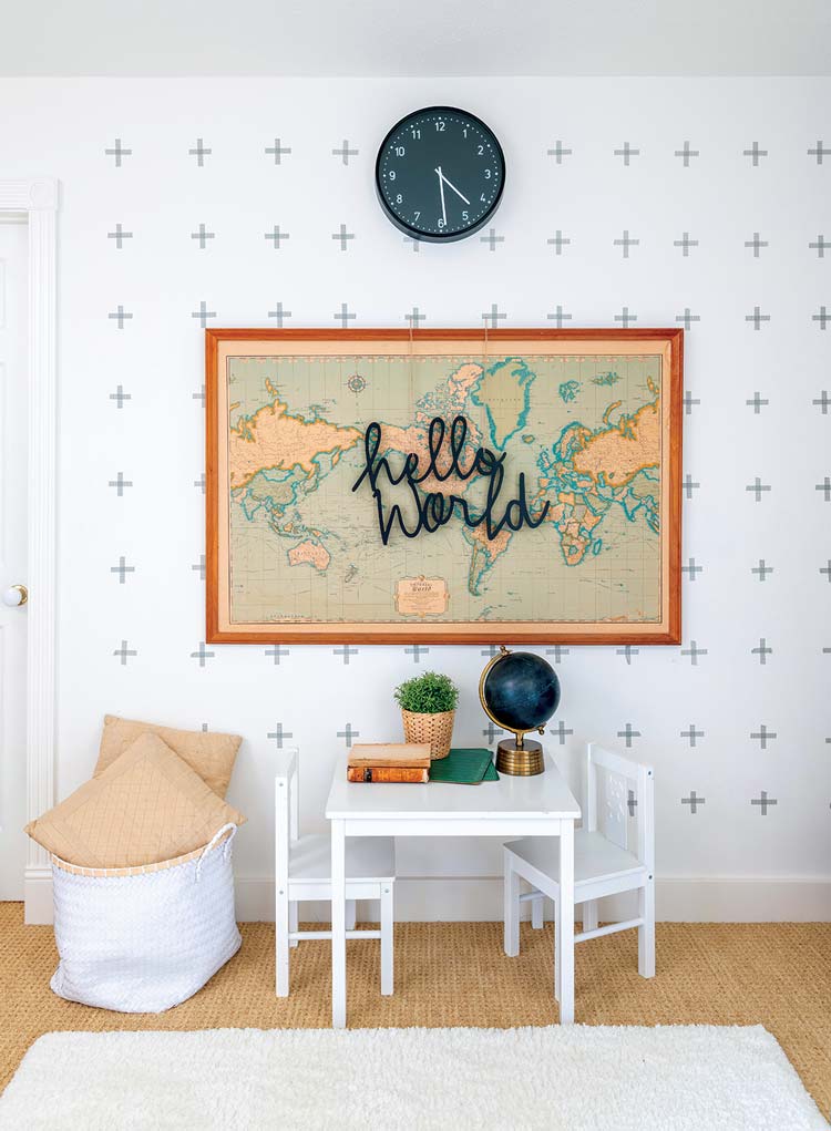 playroom with neutral color scheme and plus sign wallpaper