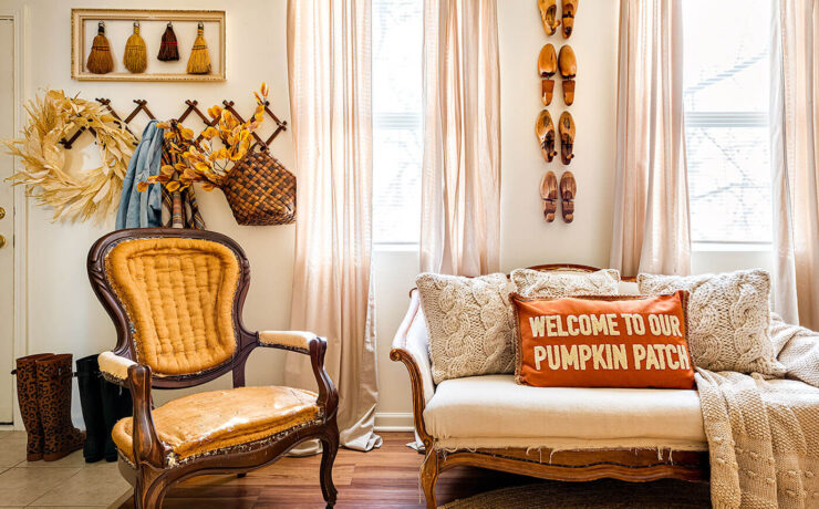 Living room with vintage fall decor on the walls and sofa