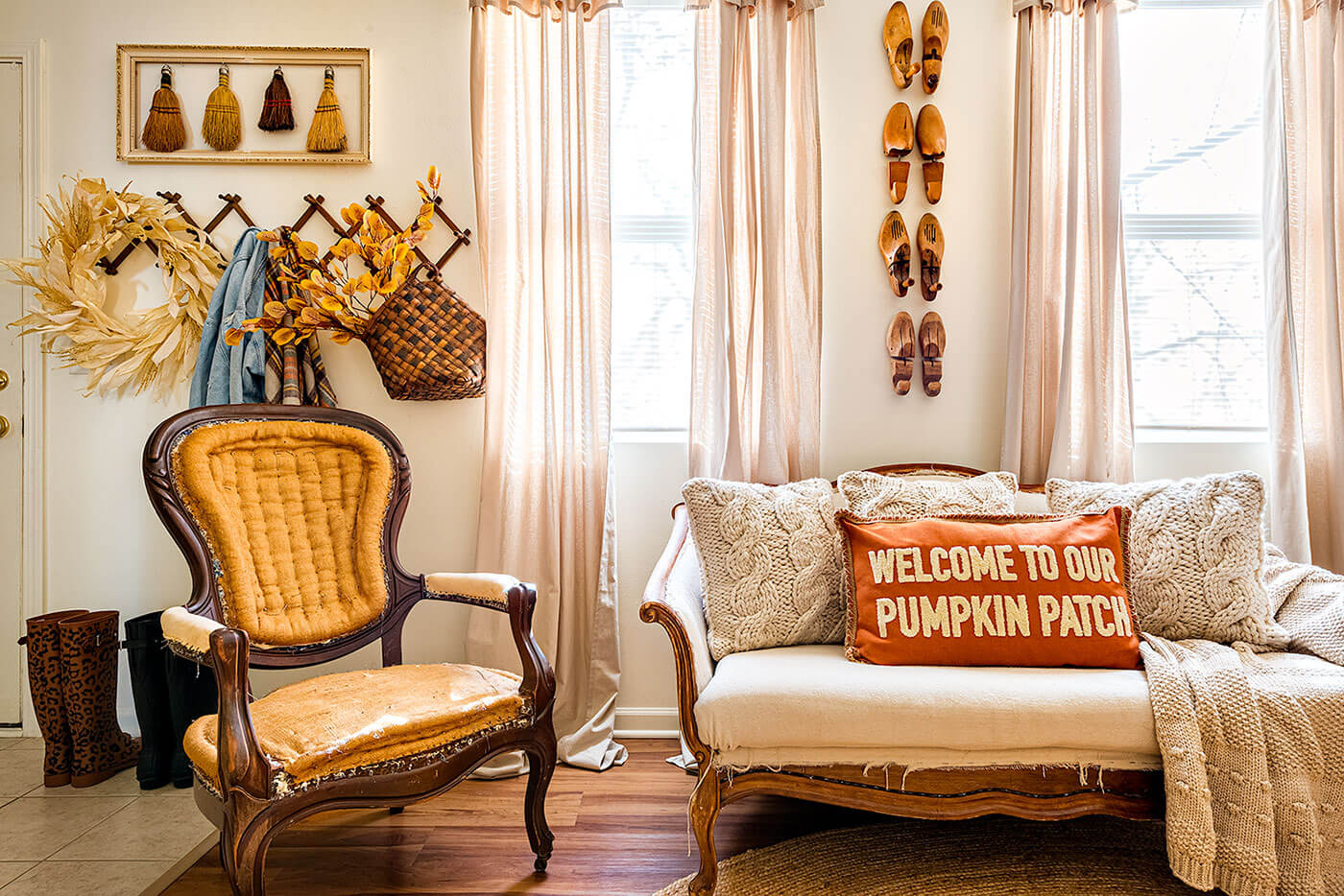 Living room with vintage fall decor on the walls and sofa