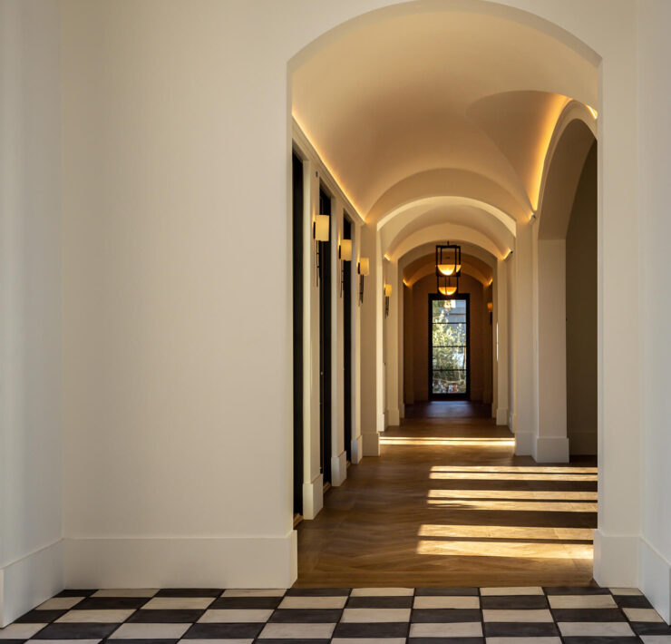 Hallway with art tile on ground in foyer