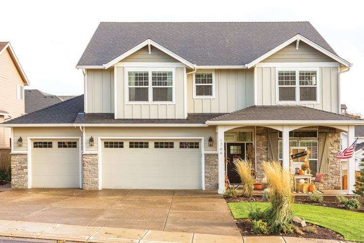 exterior of home with porch decorated for fall