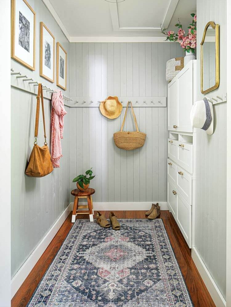 mudroom with beadboard and rug in modern Michigan farmhouse