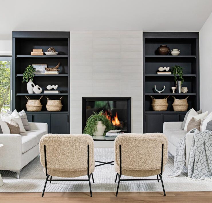 living room with built in shelves, fireplace and white couches