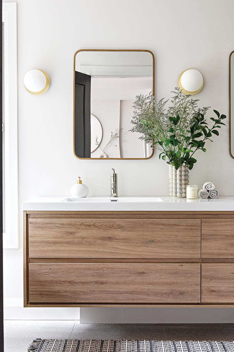 floating vanity and rounded mirrors in Ontario home