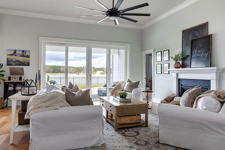 Living room with modern coastal farmhouse style and large windows