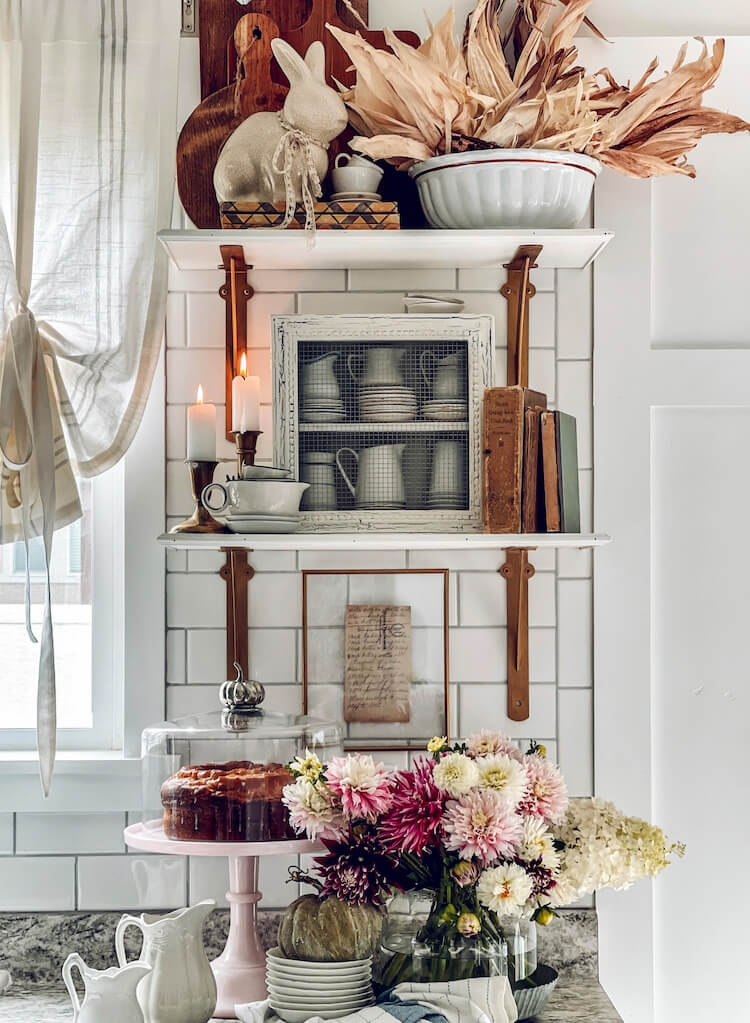 fall vignette in kitchen with floral arrangement and dried husks