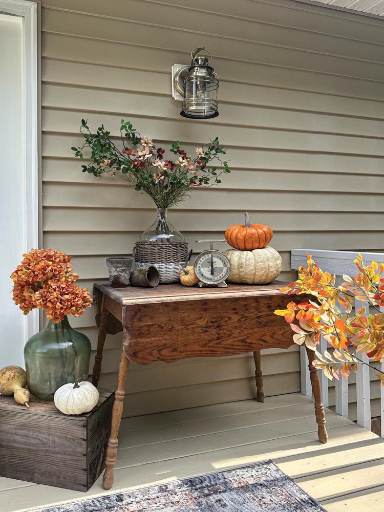 outdoor wall sconce with fall vignette