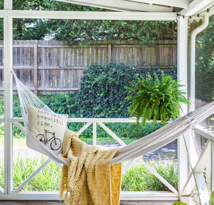 Sun porch with hammock and blanket, with tips to buy a farmhouse