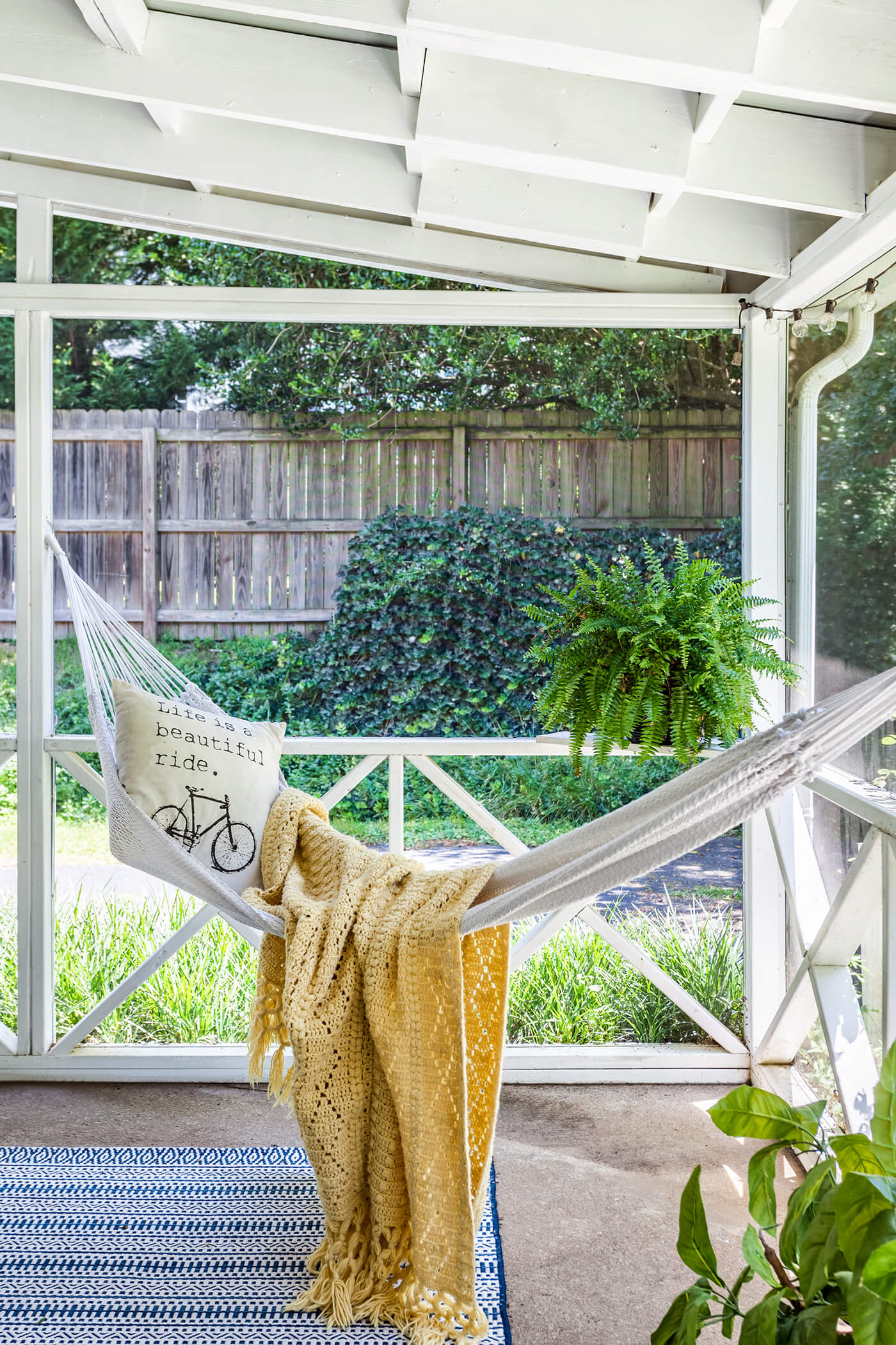 Sun porch with hammock and blanket, with tips to buy a farmhouse