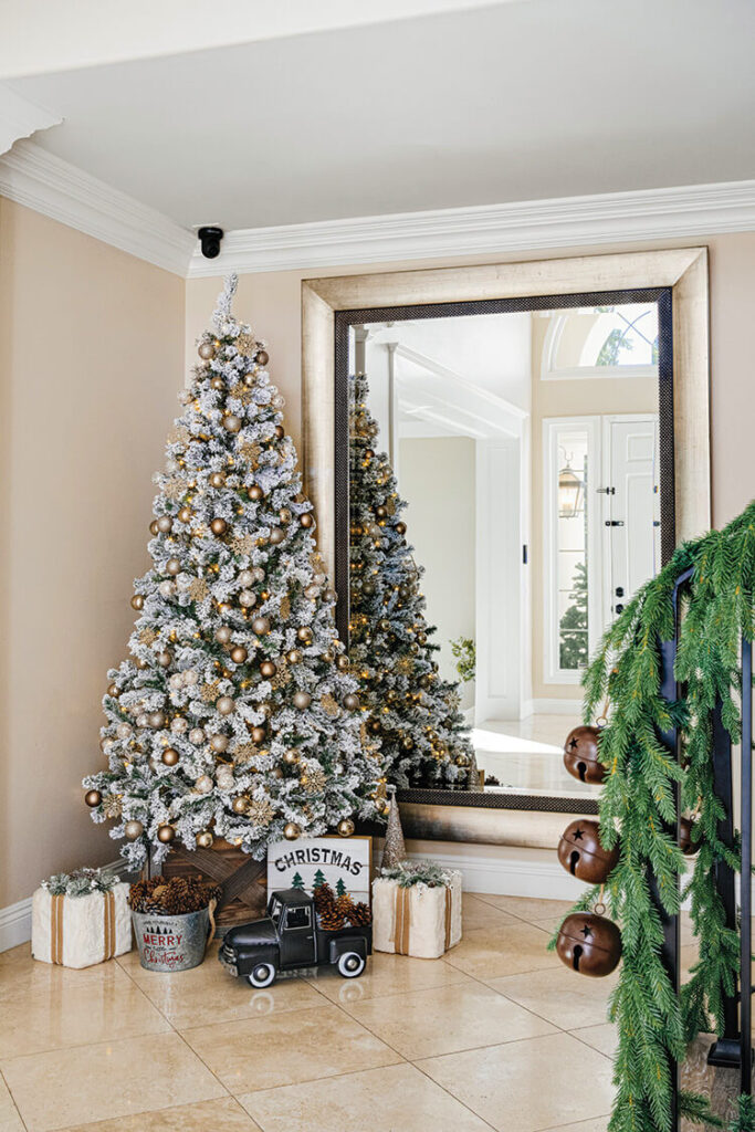 Christmas tree with neutral and gold theme in foyer