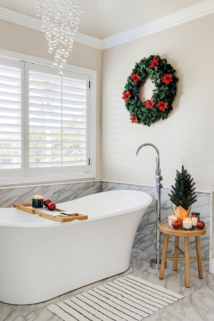 bathroom with contemporary bubble chandelier and poinsettia dotted wreath