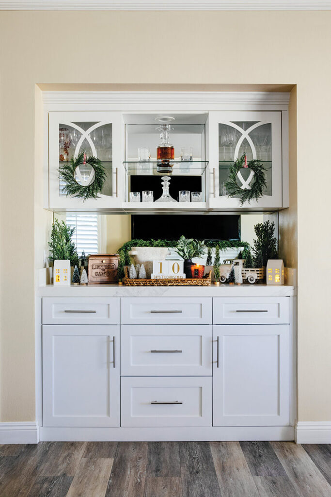 home bar Christmas decor with small wreaths on cabinet doors