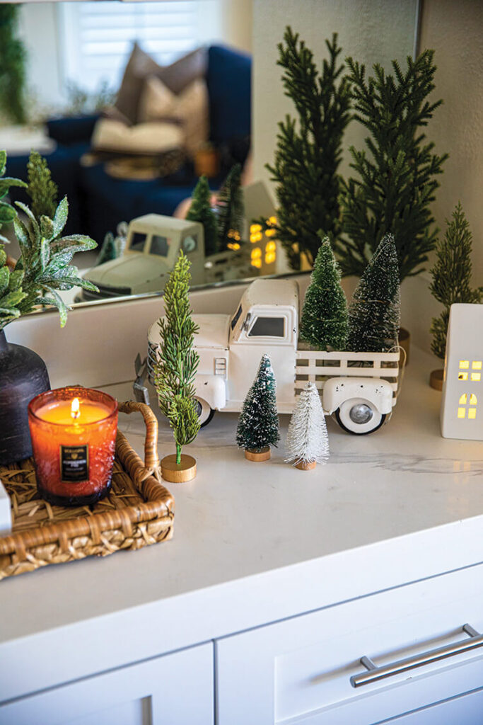 Christmas vignette with classic toy truck and bottlebrush trees