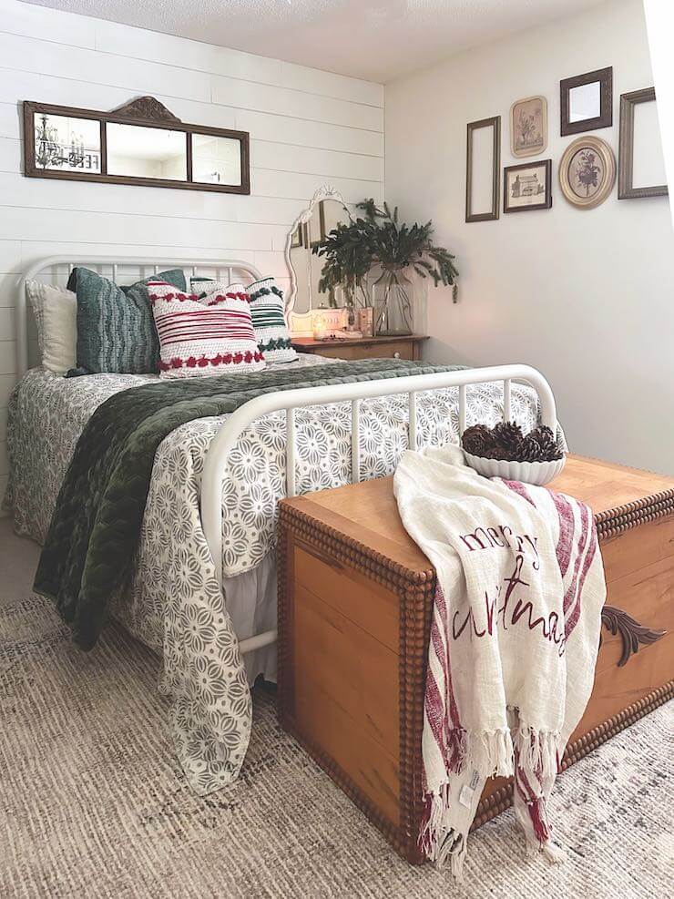 bowl of pinecones and Christmas throw in guest bedroom