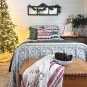 throw blanket, Christmas tree, fresh greens and layered bedding in guest bedroom