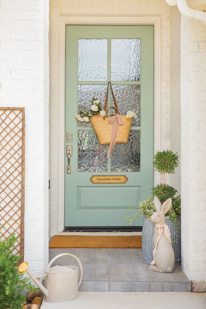 Front door with bunny and topiary for how to style spring decor