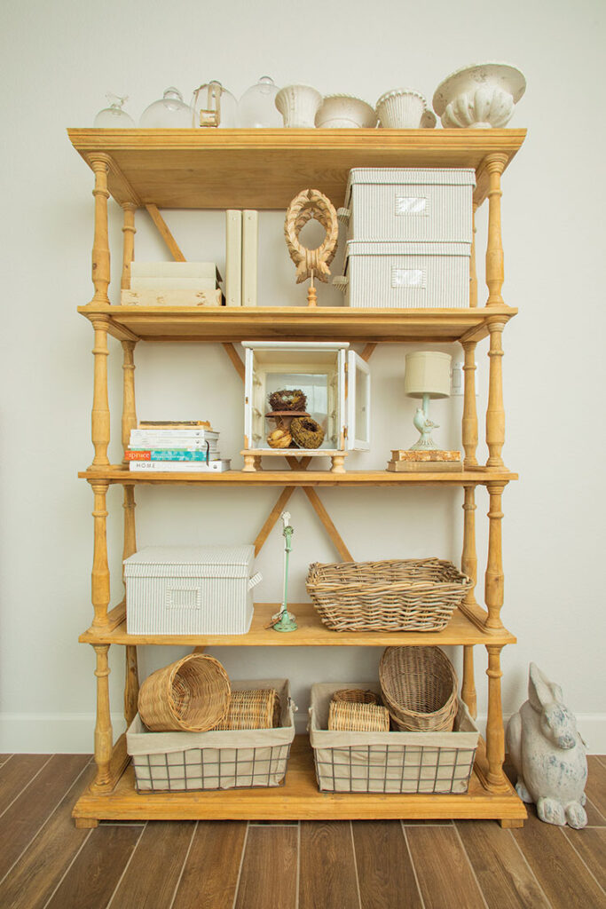 Open shelves with supplies for how to style spring decor