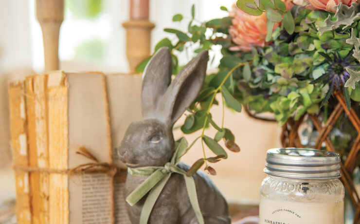 Spring decor vignette with candle, bunny and fresh flowers