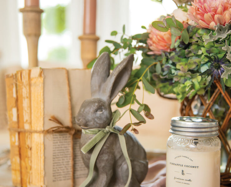 Spring decor vignette with candle, bunny and fresh flowers