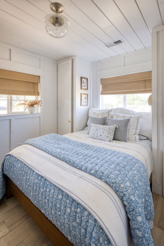 Master bedroom with small space closets on either side of the bed