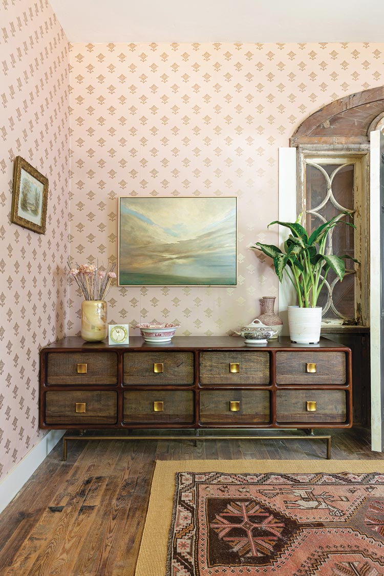 pink and gold wallpaper in primary bedroom in 1920s bungalow