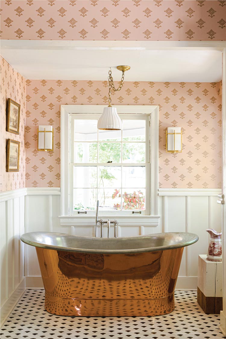 pink wallpaper and copper tub in 1920s bungalow