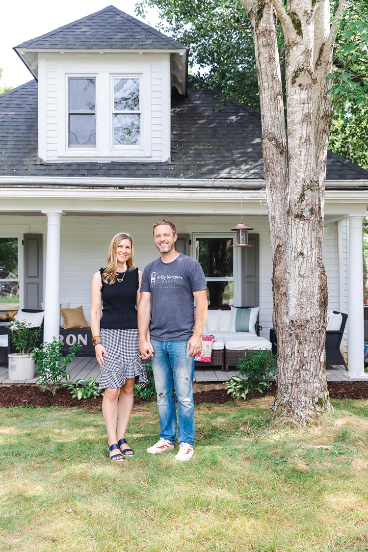 Holly Thompson and her husband David in front of 1920s bungalow