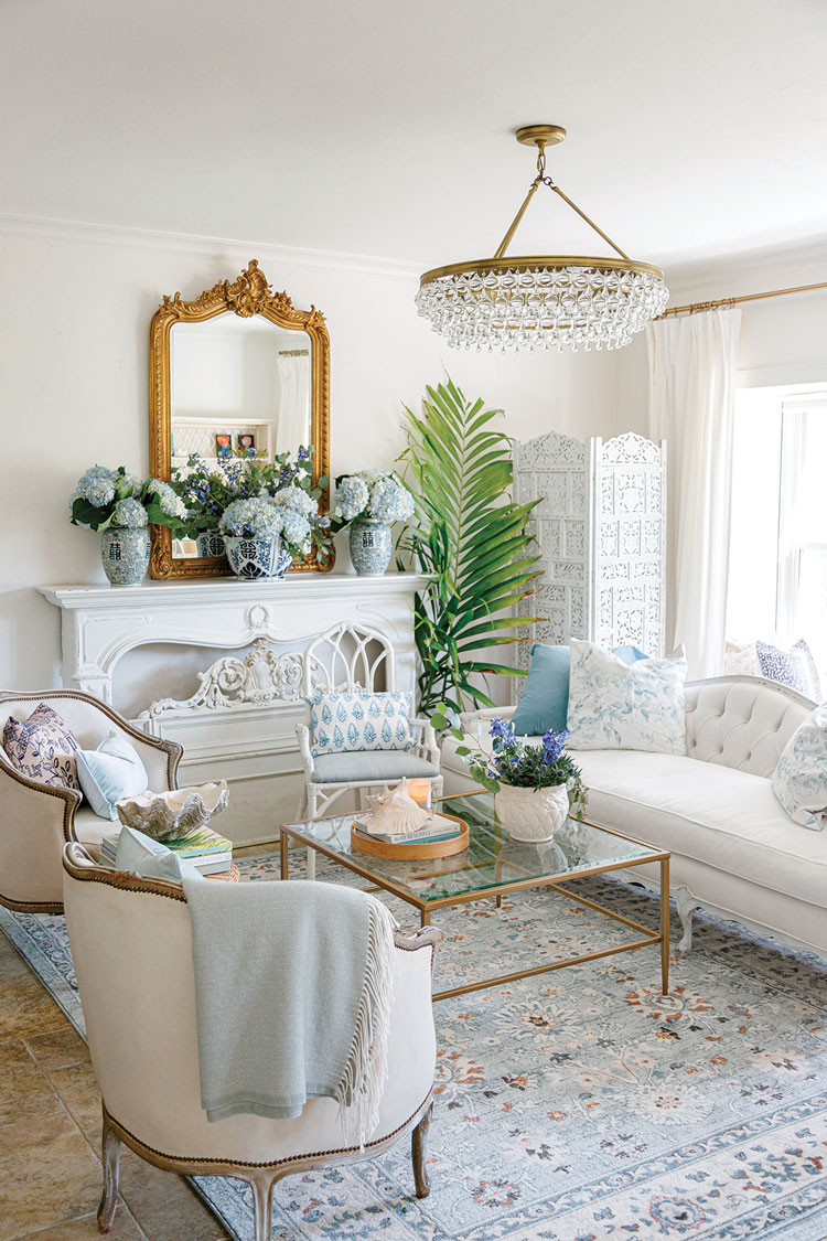living room with antique and vintage pieces with white and blue color scheme