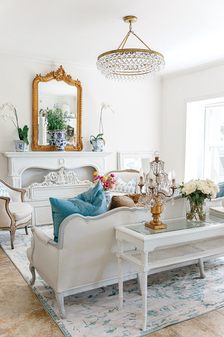 living room white and blue with floral accents in elegant Florida home