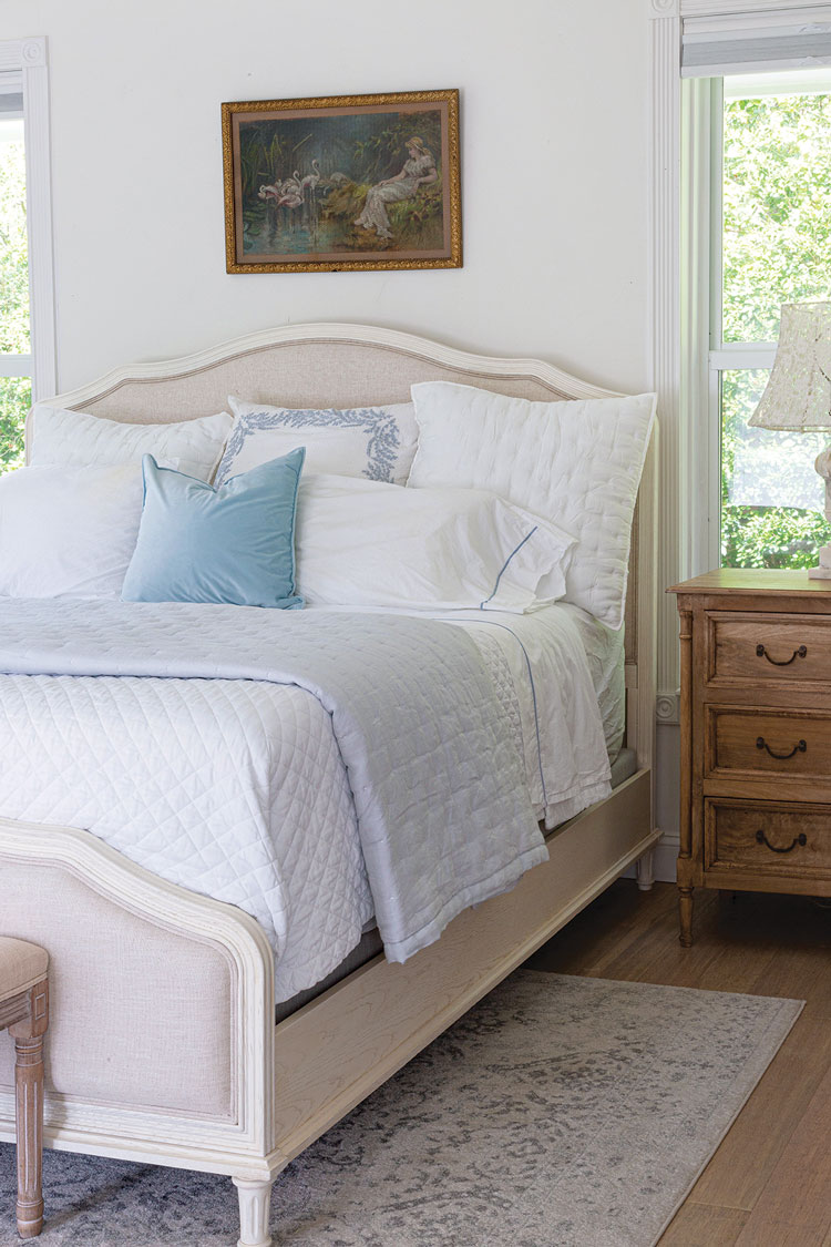 simple white and blue bedding in Florida home