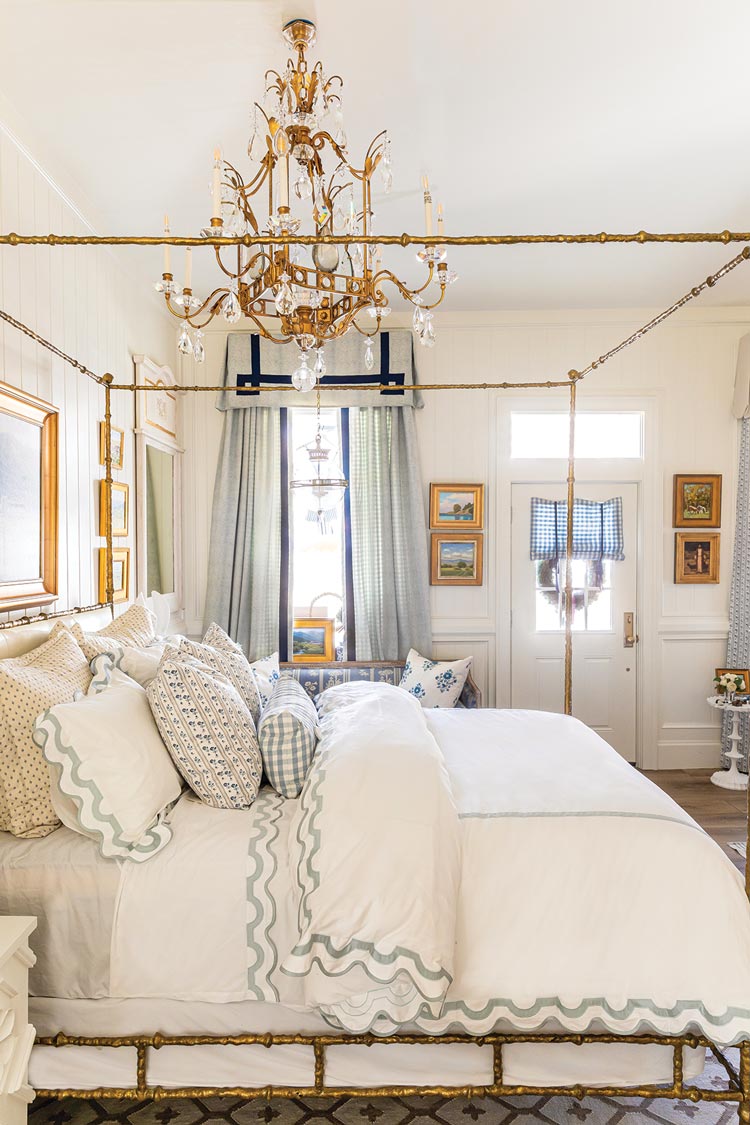 bedroom styled by The Fox Group with canopy bed and chandelier